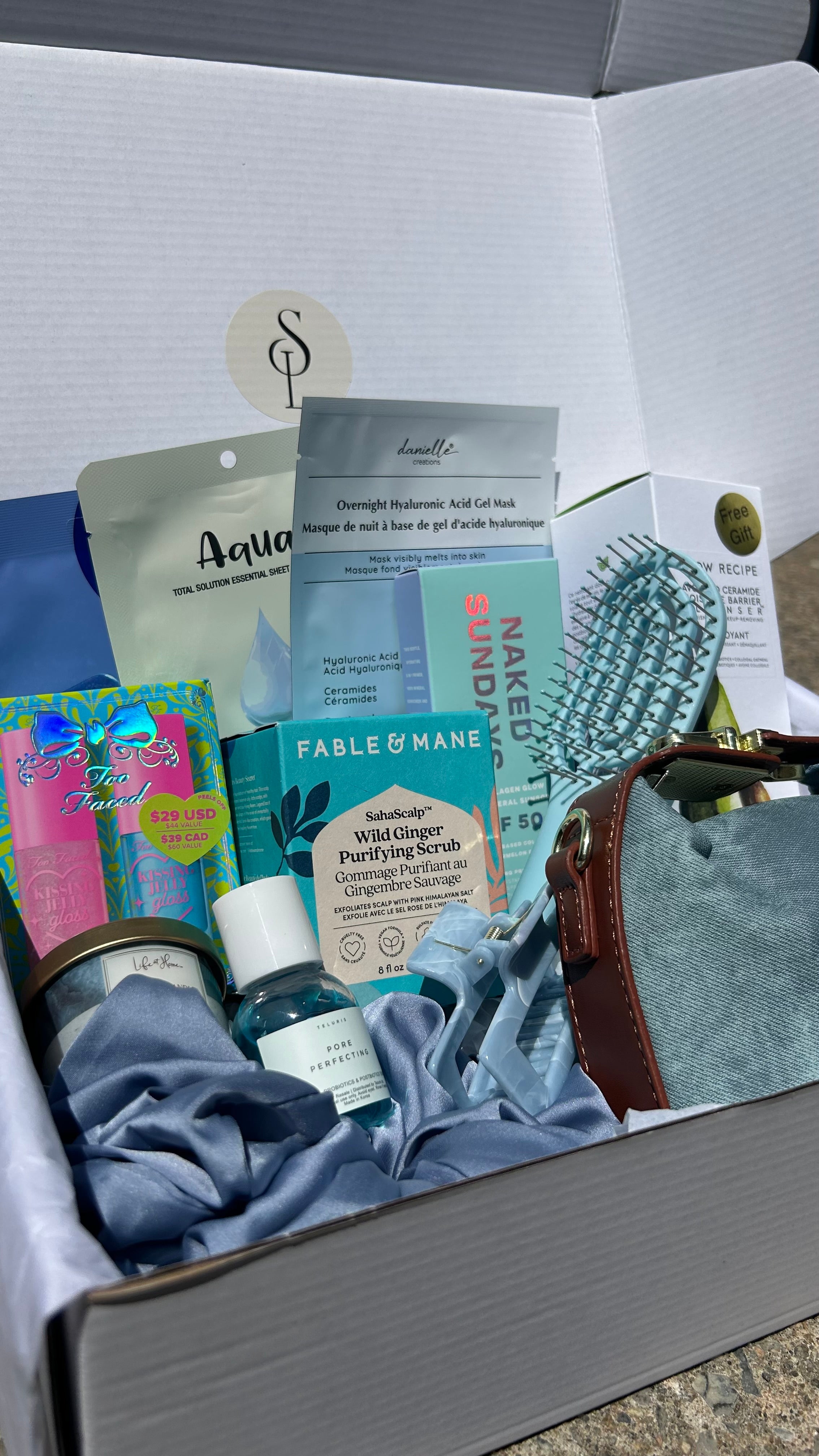 Self love box Denim-B - self-care gift box with denim handbag, skincare, makeup and hair accessories from Anastasia Beverly Hills, Fenty Beauty and more