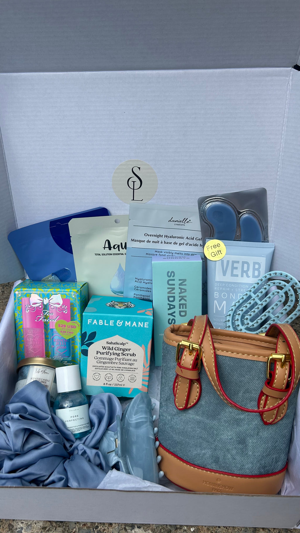 Self love box Denim-B - self-care gift box with denim handbag, skincare, makeup and hair accessories from Anastasia Beverly Hills, Fenty Beauty and more