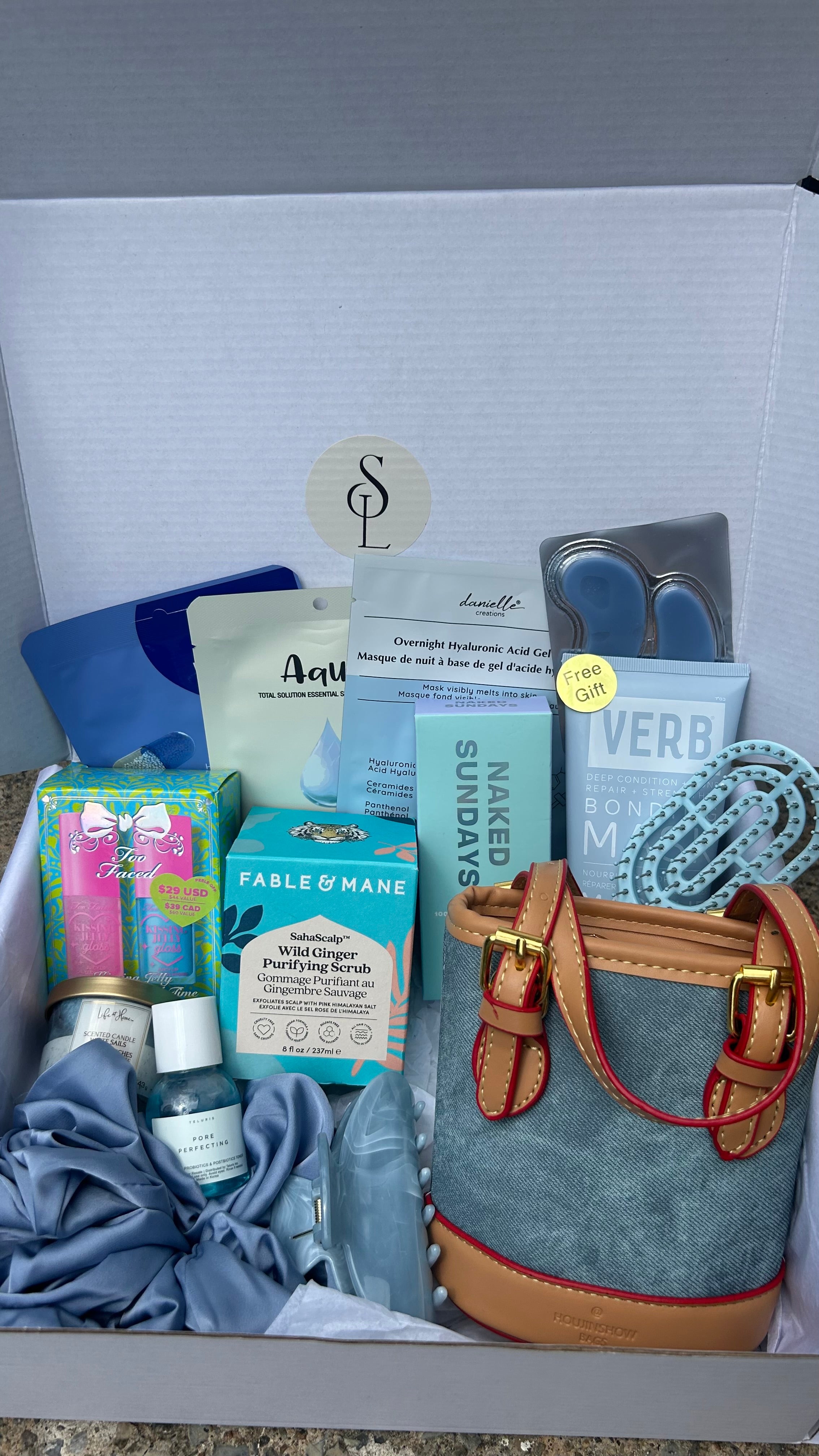 Self love box Denim-B - self-care gift box with denim handbag, skincare, makeup and hair accessories from Anastasia Beverly Hills, Fenty Beauty and more