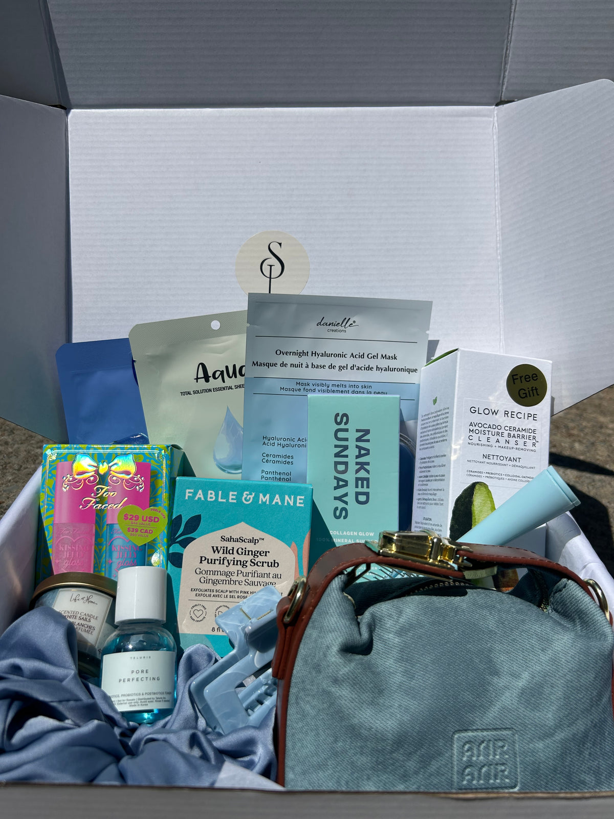 Self love box Denim-B - self-care gift box with denim handbag, skincare, makeup and hair accessories from Anastasia Beverly Hills, Fenty Beauty and more